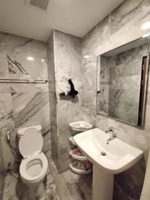 a bathroom with a toilet and a sink at Heavenly place 777 on Mai Khao in Ban Mai Salae