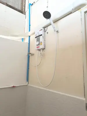 a shower in a bathroom with a shower at Modern Sunset Sea House Lam Sai in Ko Yao Noi