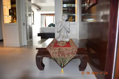 a statue sitting on a table in a room at KALIM RESIDENCE UNIT 133 VUE MER in Patong Beach