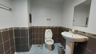 a bathroom with a toilet and a sink at Benetti house in Patong Beach