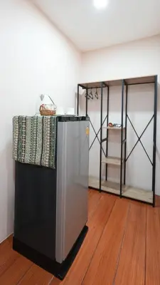 a black and silver refrigerator in a room at So View Phuket Resort in Ban Sam Kong