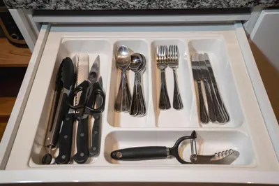 a white tray with utensils in a drawer at Pool Access Condo Bangtao Beach in Bang Tao Beach