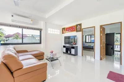 a living room with a couch and a table at Chonlada Pool Villa - 6-BR - Kamala Beach in Phuket Town