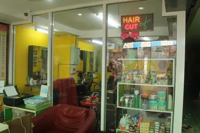 a store window with a hair gift sign in a store at Rc Guest House in Phi Phi Don