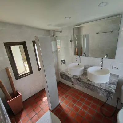 a bathroom with two sinks and a shower at Baiyok Villa seaview and edge pool in Patong Beach
