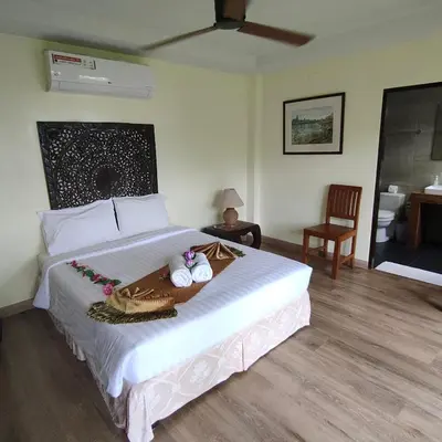 a bedroom with a large bed with a tray on it at Baiyok Villa seaview and edge pool in Patong Beach