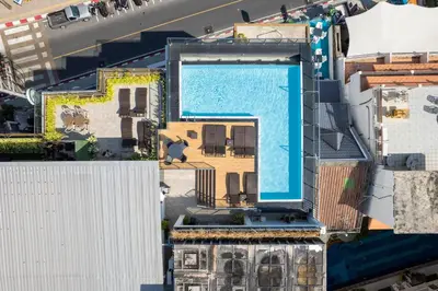 an overhead view of a building with a swimming pool at Patong Signature Boutique Hotel in Patong Beach
