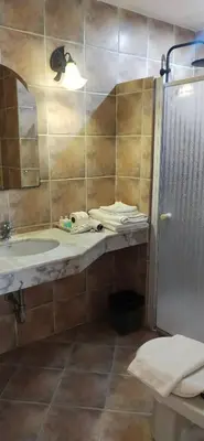 a bathroom with a sink and a mirror at Rendez Vous Hotel in Patong Beach