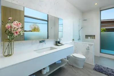 a bathroom with a sink and a toilet and a mirror at Villa Mimosa 1, Luxury 4BR with Private Pool/Rawai in Phuket Town
