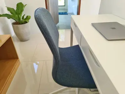 an office chair sitting at a desk with a laptop at Villa Mimosa 1, Luxury 4BR with Private Pool/Rawai in Phuket Town