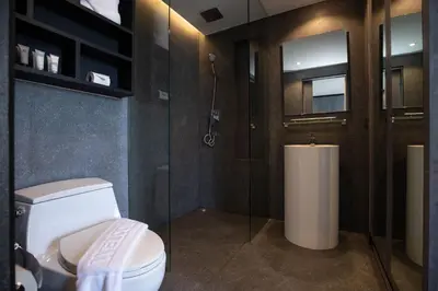 a bathroom with a toilet and a shower at Tropics Kamala Pool View Residence CTG B704 in Kamala Beach
