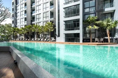 a large swimming pool in front of a building at tropics Kamala Deluxe Pool View Apartment CTG P602 in Kamala Beach