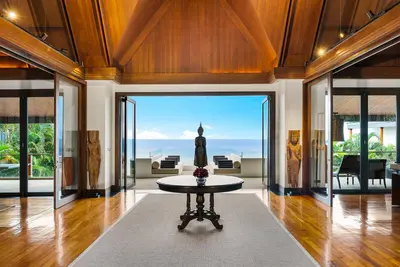a large living room with a statue in the middle at Villa Aye in Kamala Beach