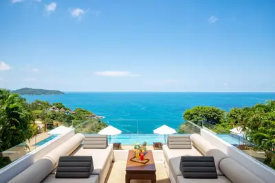 a view of the ocean from the balcony of a villa at Villa Aye in Kamala Beach