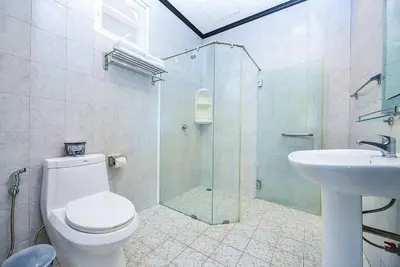 a bathroom with a shower and a toilet and a sink at Unique&Nice 7BD pool villa in heart Nanai Patong in Patong Beach