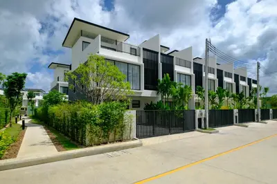 an apartment building with a black and white at 3bdr Townhouse In Laguna Park #116 in Bang Tao Beach