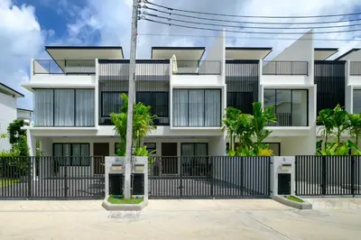 an apartment building with a black fence at 3bdr Townhouse In Laguna Park #116 in Bang Tao Beach