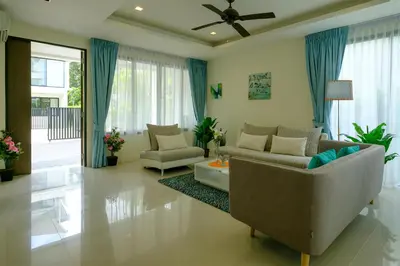 a living room with two chairs and a couch at 3bdr Townhouse In Laguna Park #116 in Bang Tao Beach