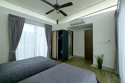a bedroom with a bed and a ceiling fan at 3bdr Townhouse In Laguna Park #116 in Bang Tao Beach