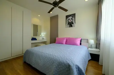 a bedroom with a bed with pink pillows and a ceiling at 3bdr Townhouse In Laguna Park #116 in Bang Tao Beach