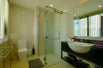 a bathroom with a sink and a shower and a toilet at 3bdr Townhouse In Laguna Park #116 in Bang Tao Beach