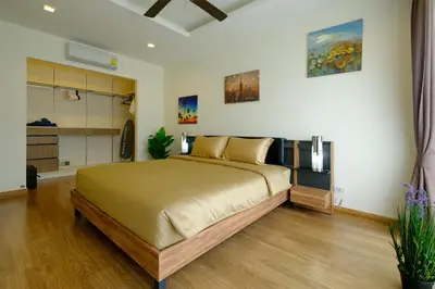 a bedroom with a large bed in a room at 3bdr Townhouse In Laguna Park #118 by Capital Pro in Thalang