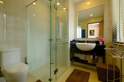a bathroom with a toilet and a sink and a shower at 3bdr Townhouse In Laguna Park #118 by Capital Pro in Thalang