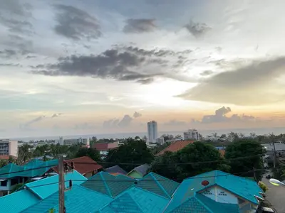 a view of a city with blue roofs at Scan House Apartment in Karon Beach