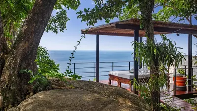 a view of the ocean from the deck of a house at Villa Varya in Amphoe Thalang