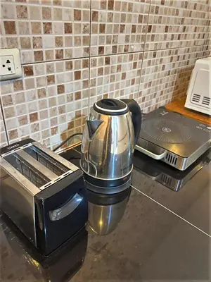 a coffee maker sitting on a counter next to a toaster at 2BR Private Villa Natural Stone Style A3 in Ban Thalat Choeng Thale