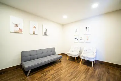 a living room with a couch and two chairs at Patong tower Superior Seaview 4BR-2102 in Patong Beach