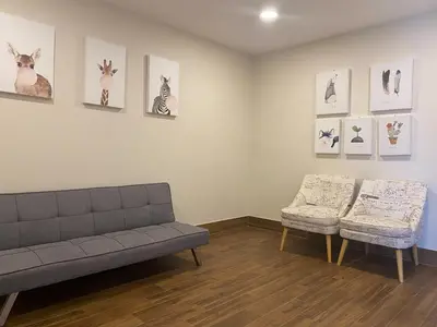 a living room with a couch and two chairs at Patong tower Superior Seaview 4BR-2102 in Patong Beach