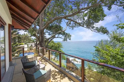 a balcony with a view of the ocean at Villa Horizon in Phuket Town