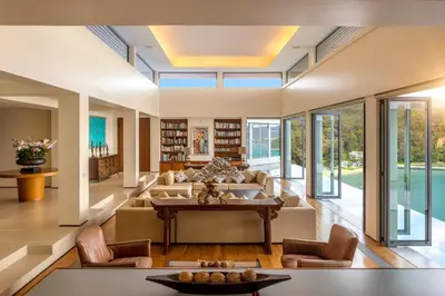 a living room with a couch and a table at Villa Fah Sai in Phuket Town