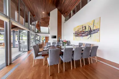 a dining room with a table and chairs at Villa Viman in Kathu