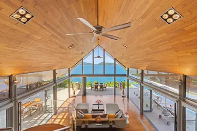 an open living room with a ceiling fan at Villa Hale Malia in Kathu