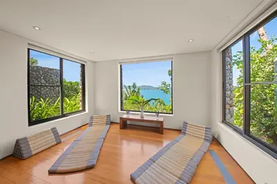 a room with three benches in front of windows at Villa Hale Malia in Kathu