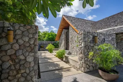 a stone building with a stone wall at Villa Hale Malia in Kathu