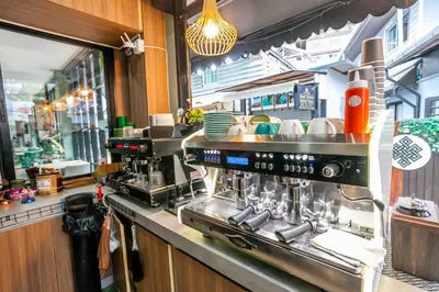 a kitchen with a coffee machine on a counter at Coco Bella Hotel in Phi Phi Don