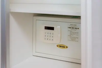 a microwave oven with a control panel in a wall at The Title Condo by Tropiclook in Rawai Beach