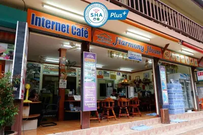 a restaurant with a sign in front of it at Harmony House-SHA Plus in Phi Phi Don