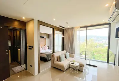 a living room with a couch and a bed at Citygate in Kamala beach - Perfect Stay for Digital Work in Kamala Beach