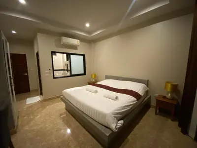 a bedroom with a bed and a window in it at Кондо в райском уголке Равай in Rawai Beach