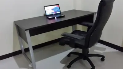 a desk with a laptop computer on top of it at ViewPoint Villa in Kathu