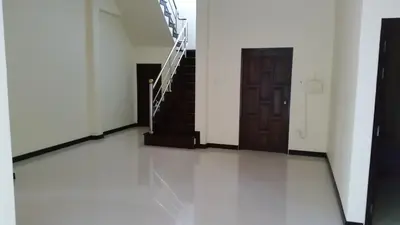 a hallway with stairs and a wooden door at ViewPoint Villa in Kathu