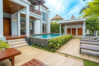 a swimming pool in the backyard of a house at Villa Autjima krabi /3BRD in Ban Khlong Haeng