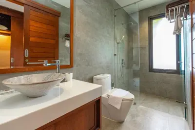 a bathroom with a sink and a toilet and a shower at Villa Autjima krabi /3BRD in Ban Khlong Haeng
