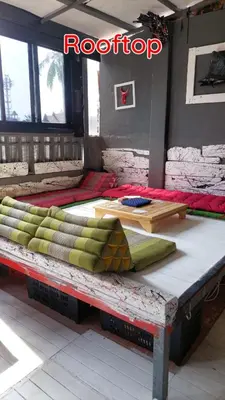 a room with several pillows sitting on a table at Dormsin Chill in Phi Phi Don