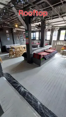 a room with a floor with a bed on it at Dormsin Chill in Phi Phi Don