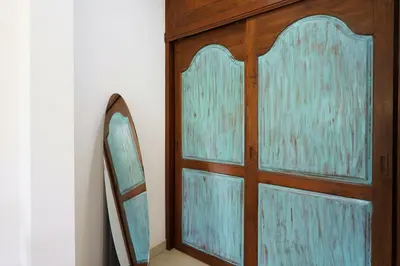 a wooden door with a mirror next to a mirror at Montaplan Villa by G Estate in Rawai Beach